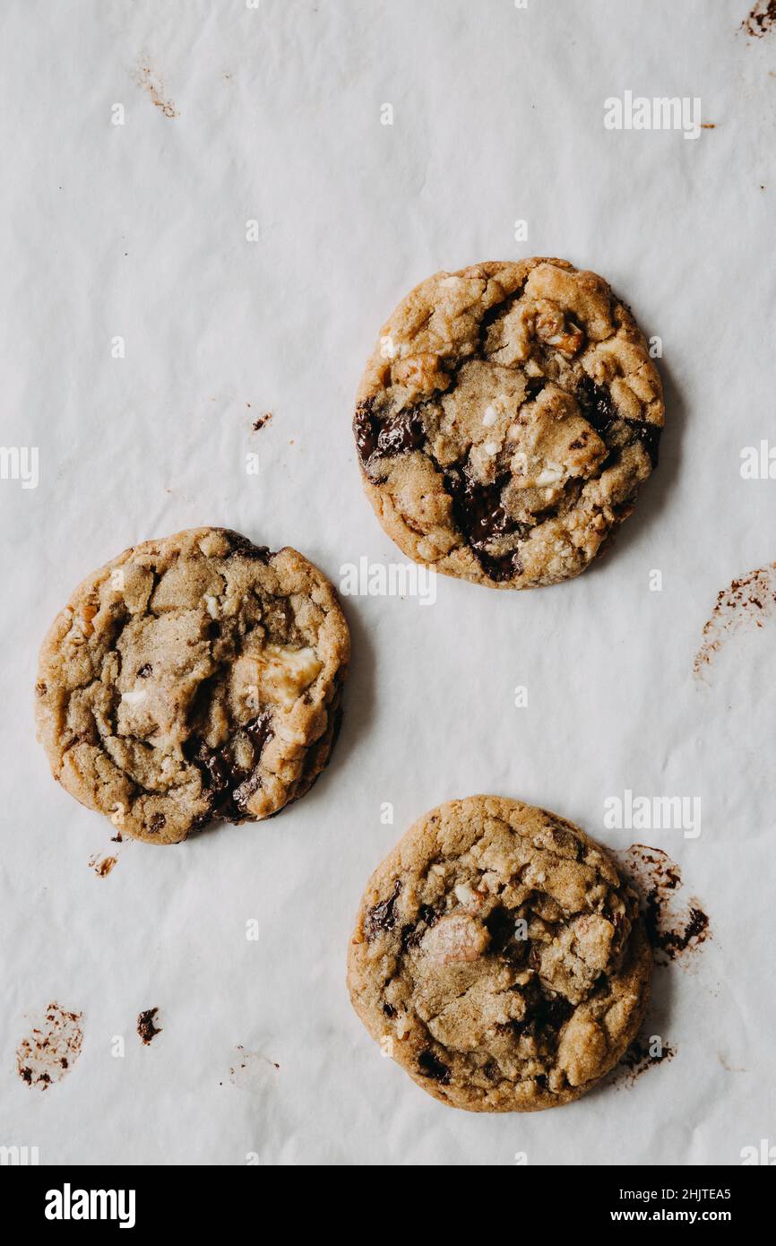 Chocolate chip cookies on greaseproof paper Stock Photo