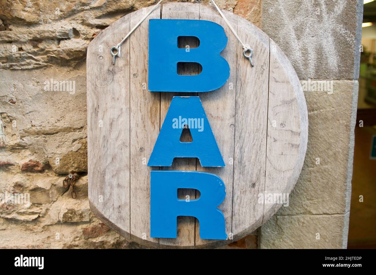 Blue BAR inscription on a wooden vintage panel in front of a restaurant in Florence, Italy Stock Photo