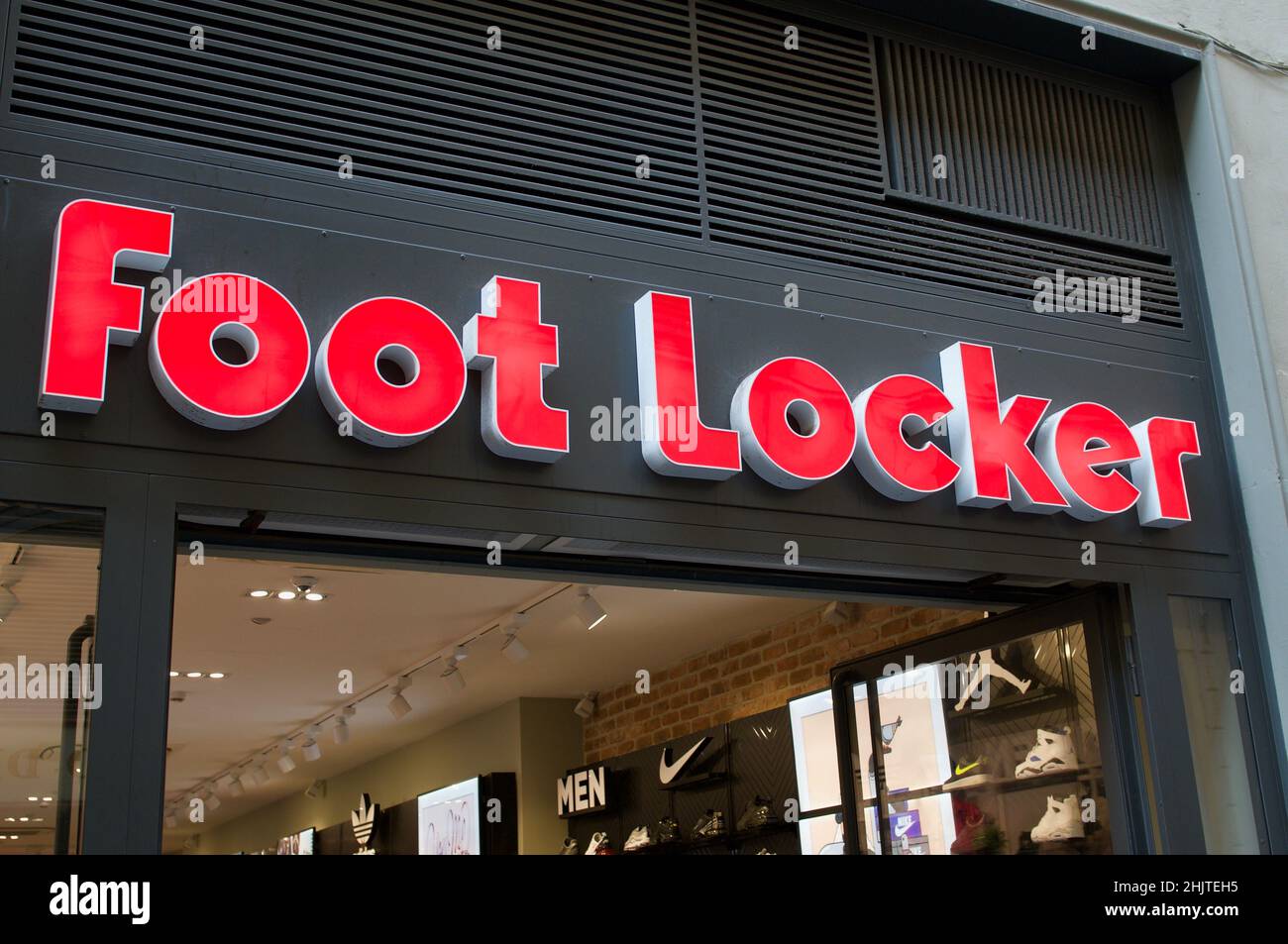 Firenze, Tuscany, Italy - 27th September 2021 : Foot Locker sign hanging over a store in Florence, Italy. Foot Locker Retail, Inc. is an American spor Stock Photo