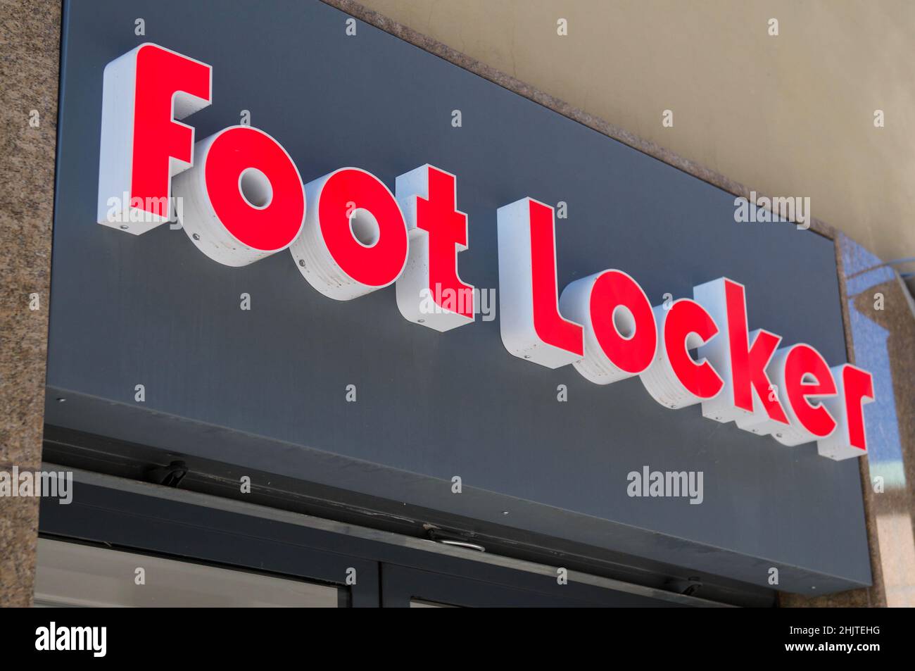 Arezzo, Tuscany, Italy - 1st October 2021 : Foot Locker sign hanging over a store in Arezzo, Italy. Foot Locker Retail, Inc. is an American sportswear Stock Photo