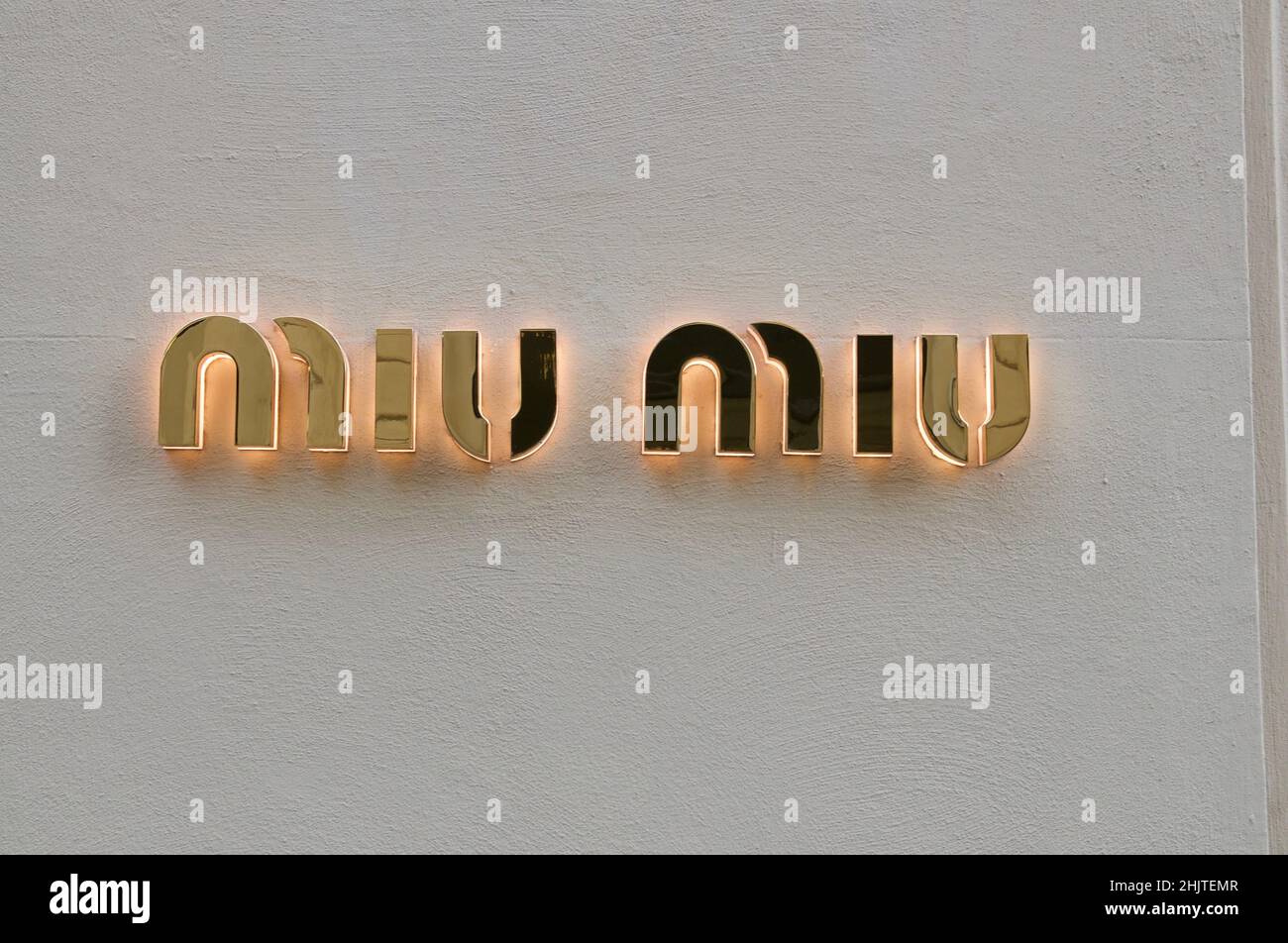 Firenze, Tuscany, Italy - 27th September 2021 : Miu Miu gilded sign hanging in front a store entrance in Florence, Italy. Miu Miu is an Italian high f Stock Photo
