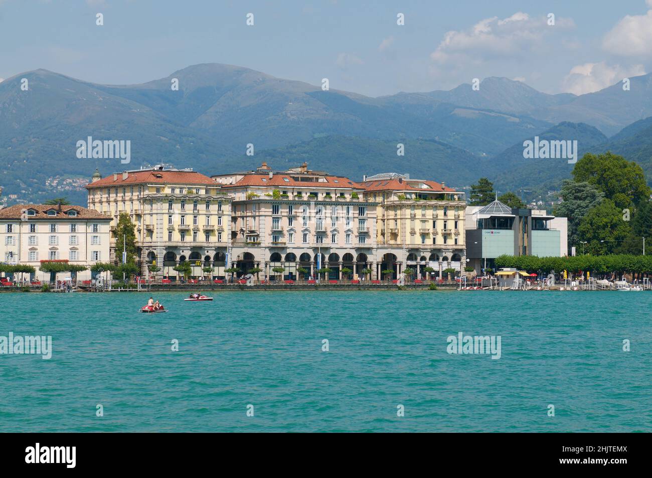 Lugano, Ticino, Switzerland - 21st August 2021 : Beautiful view of some old buildings of Lugano Switzerland seen from the lake on a sunny day in summe Stock Photo