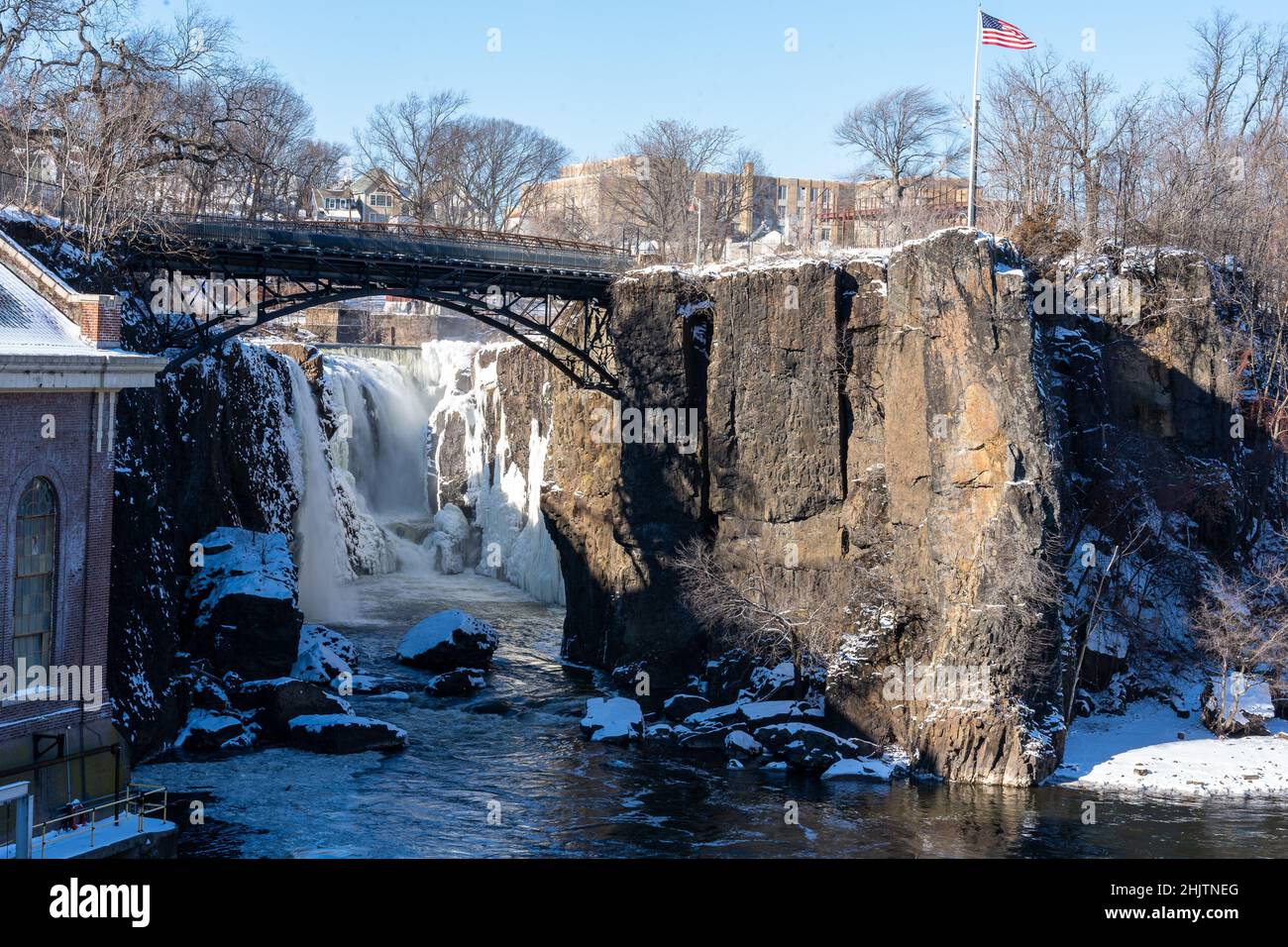Paterson, NJ - USA - Jan 30, 2022 Horizontal view of the partially frozen falls at the historic Paterson Great Falls National Historical Park during t Stock Photo