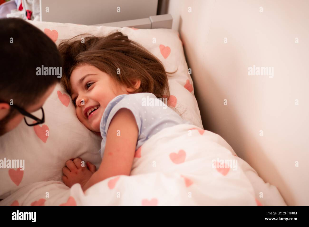 parent and child sleeping in bed Stock Photo Alamy
