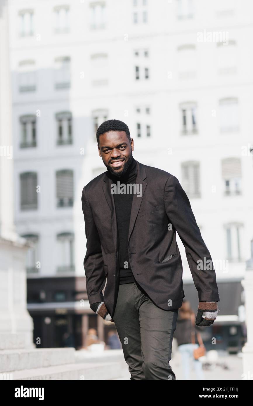 African man walking outside in hi-res stock photography and images - Alamy