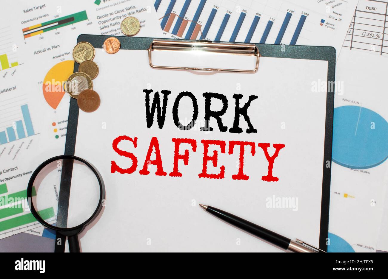 young woman show WORK SAFETY on card , business idea Stock Photo