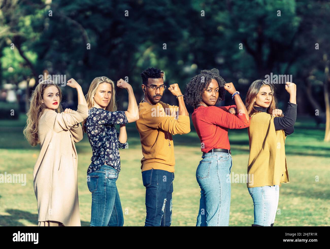 multiethnic people imitating the gesture of rosie the riveter Stock Photo