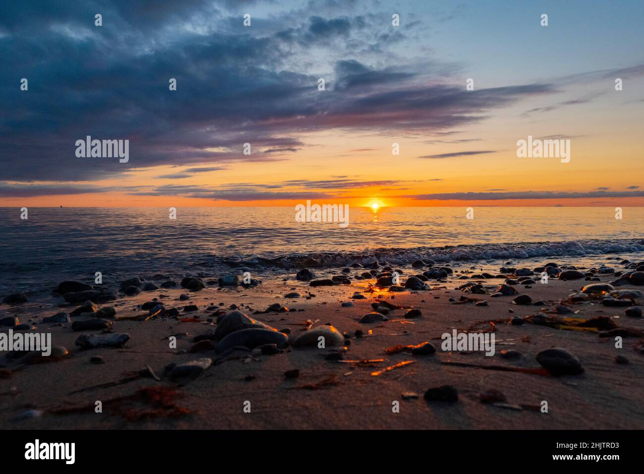 Amazing sunset at Baltic sea beach in Germany. Island Fehmarn Stock Photo