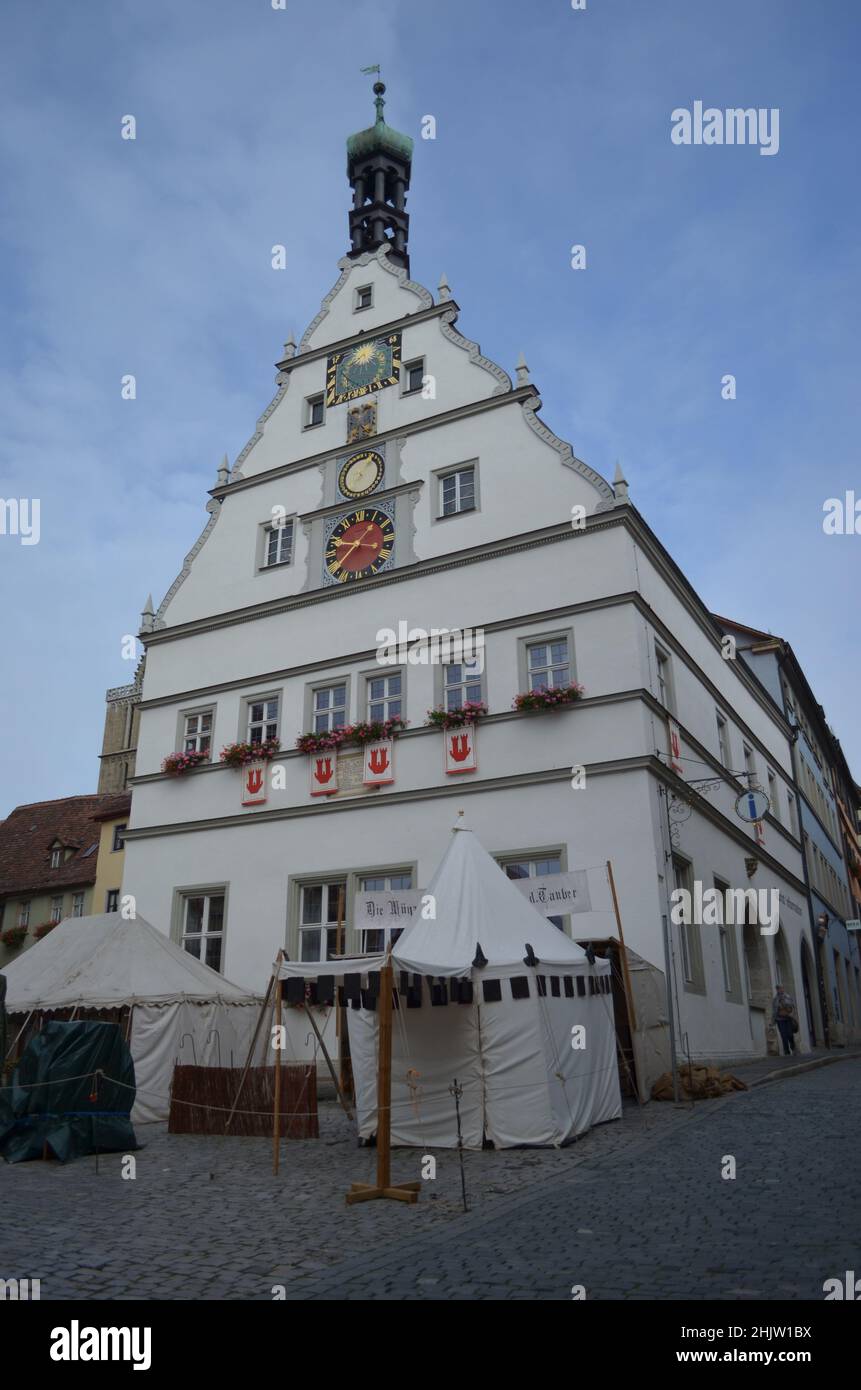 This is the Rothenburg City Counselors' Tavern in Rothenburg, Germany.  It stands in the middle of the main market square and tourist come to see it. Stock Photo