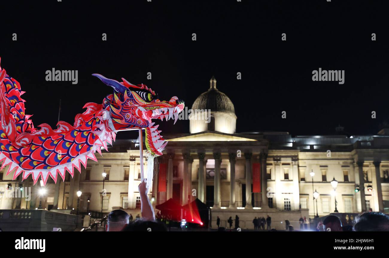 London, Britain. 31st Jan, 2022. Artists perform dragon dance to celebrate the Chinese Lunar New Year at Trafalgar Square in London, Britain, Jan. 31, 2022. Credit: Li Ying/Xinhua/Alamy Live News Stock Photo