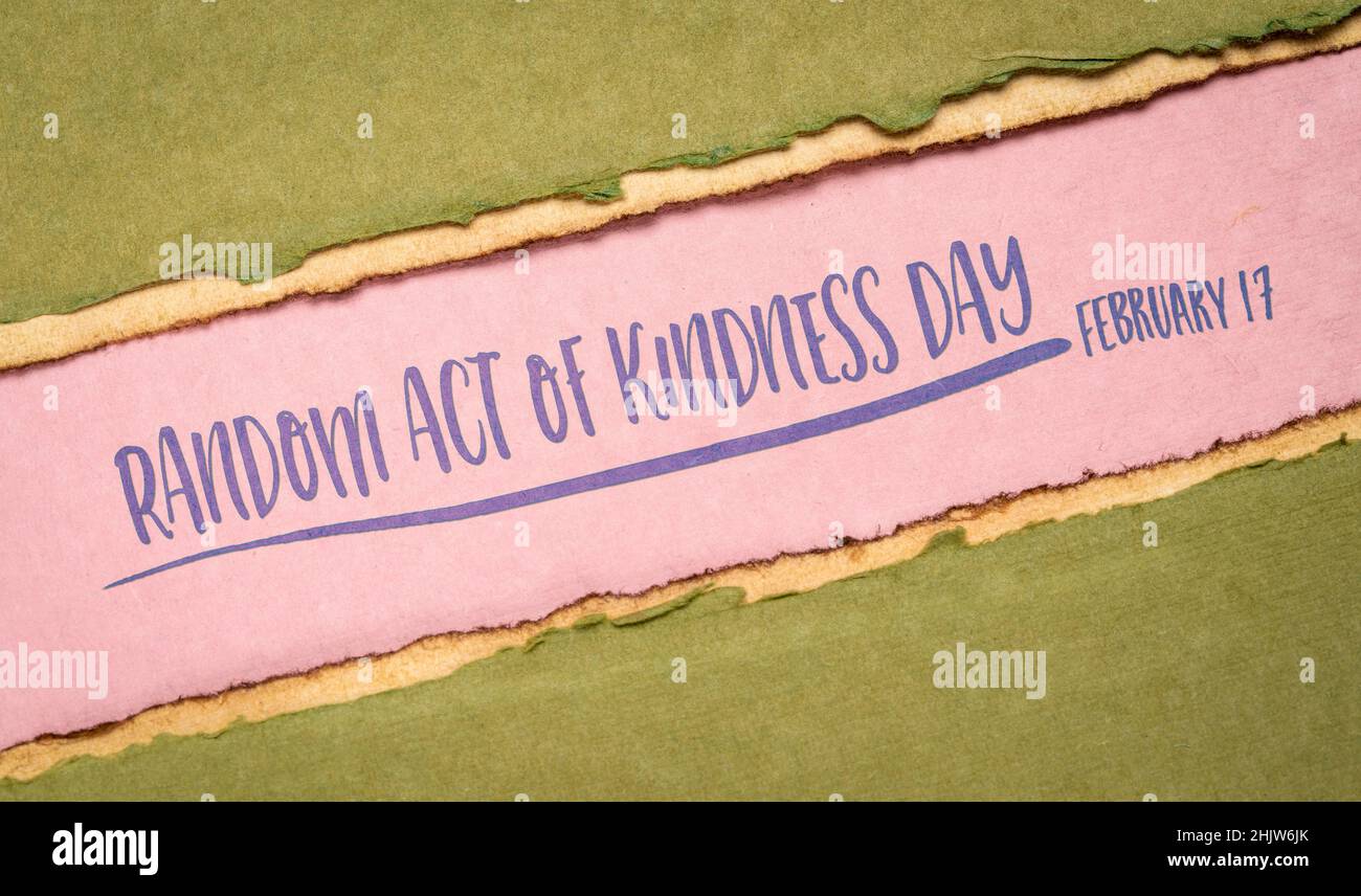 random act of kindness day inspirational reminder banner - handwriting on a handmade paper, social concept Stock Photo