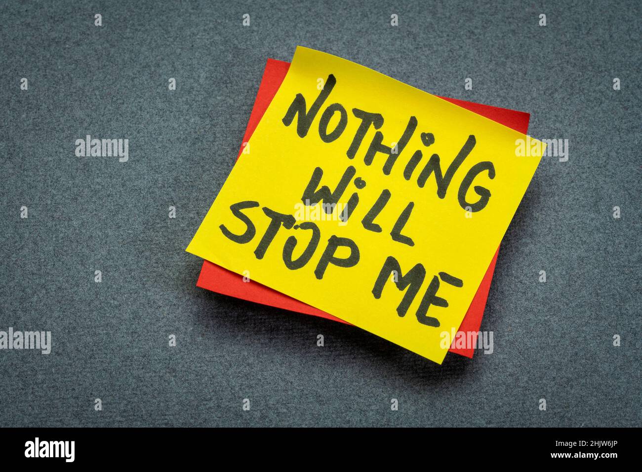 Nothing will stop me - motivational handwriting on a reminder note, positive affirmation and determination concept Stock Photo