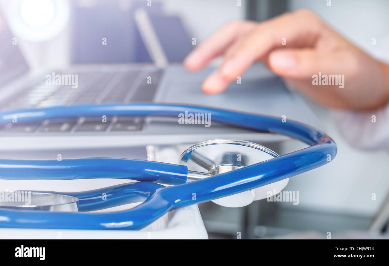 Stethoscope near the computer online doctor in the office Stock Photo