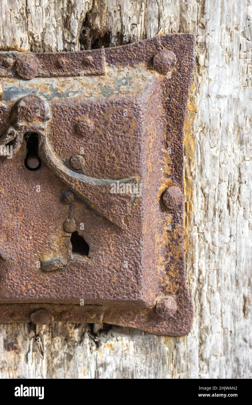 Vertical shot of an old rusty lock on an old wooden door Stock Photo ...