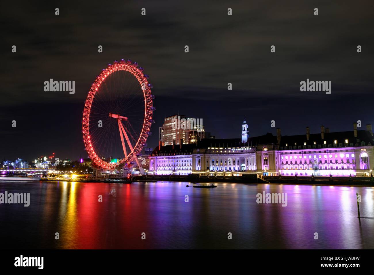 London, UK, 31st Jan, 2022. The London Eye, as seen from the River Thames is lit-up in red to celebrated the Lunar New Year - or Chinese New Year which falls on the 1st February. Credit: Eleventh Hour Photography/Alamy Live News Stock Photo