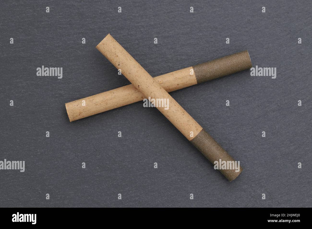 close up of cigarette on dark grey background Stock Photo