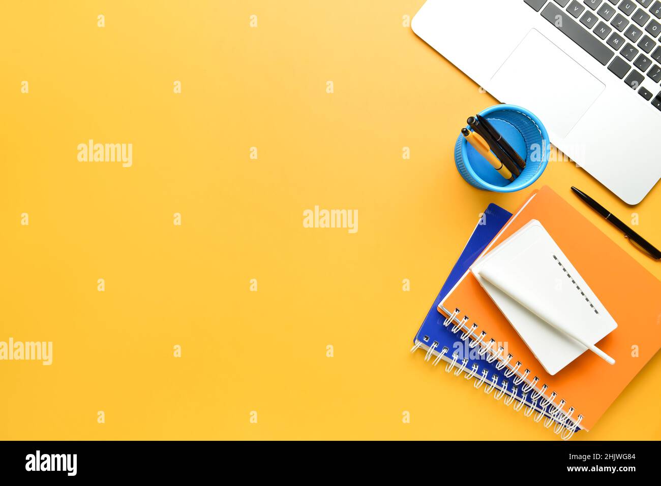 Different gadgets and stationery on color background Stock Photo