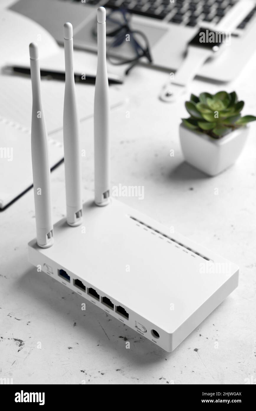 Wi-Fi router with antennas on light background Stock Photo - Alamy