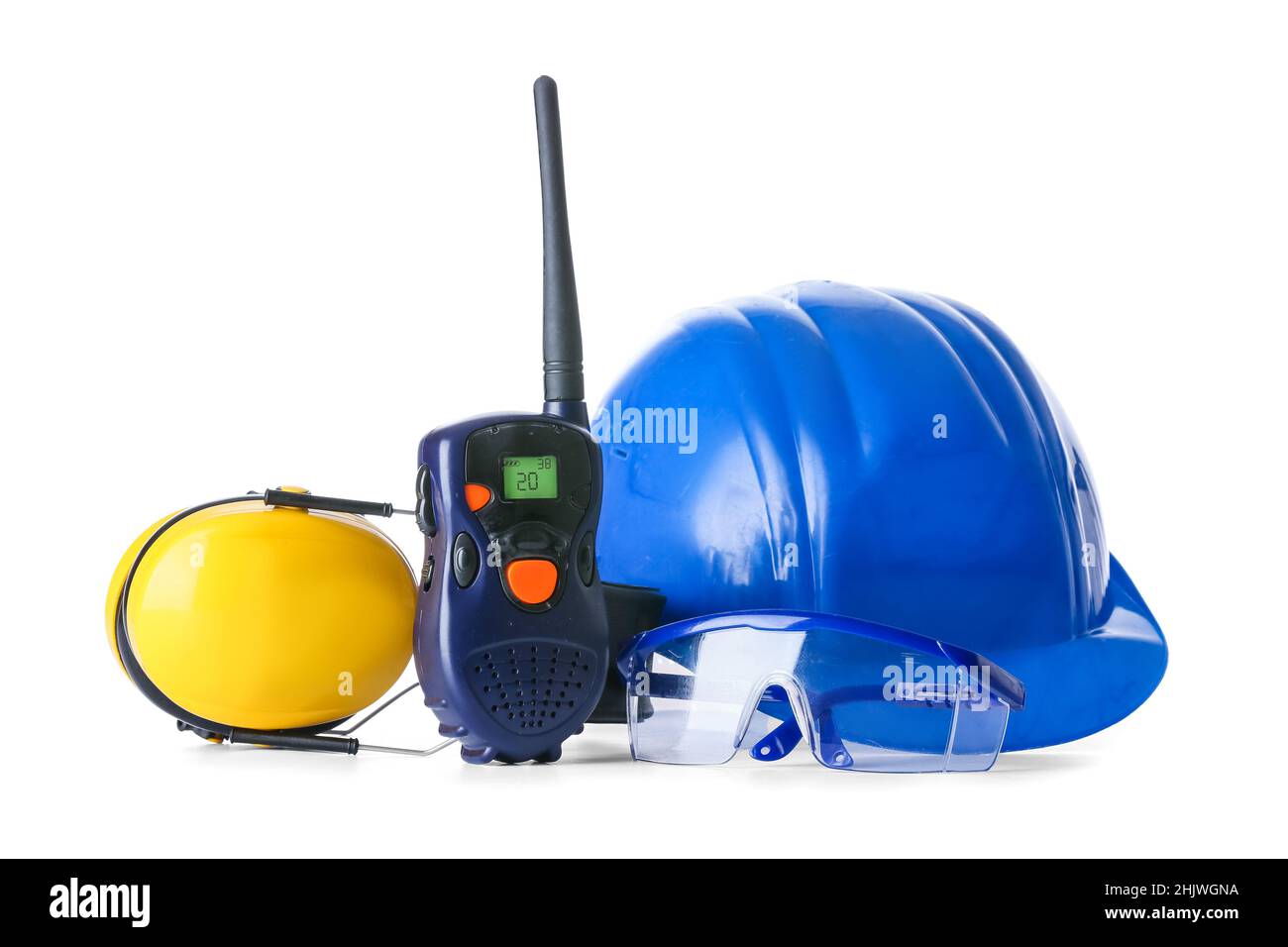 Safety equipment and radio transmitter on white background Stock Photo