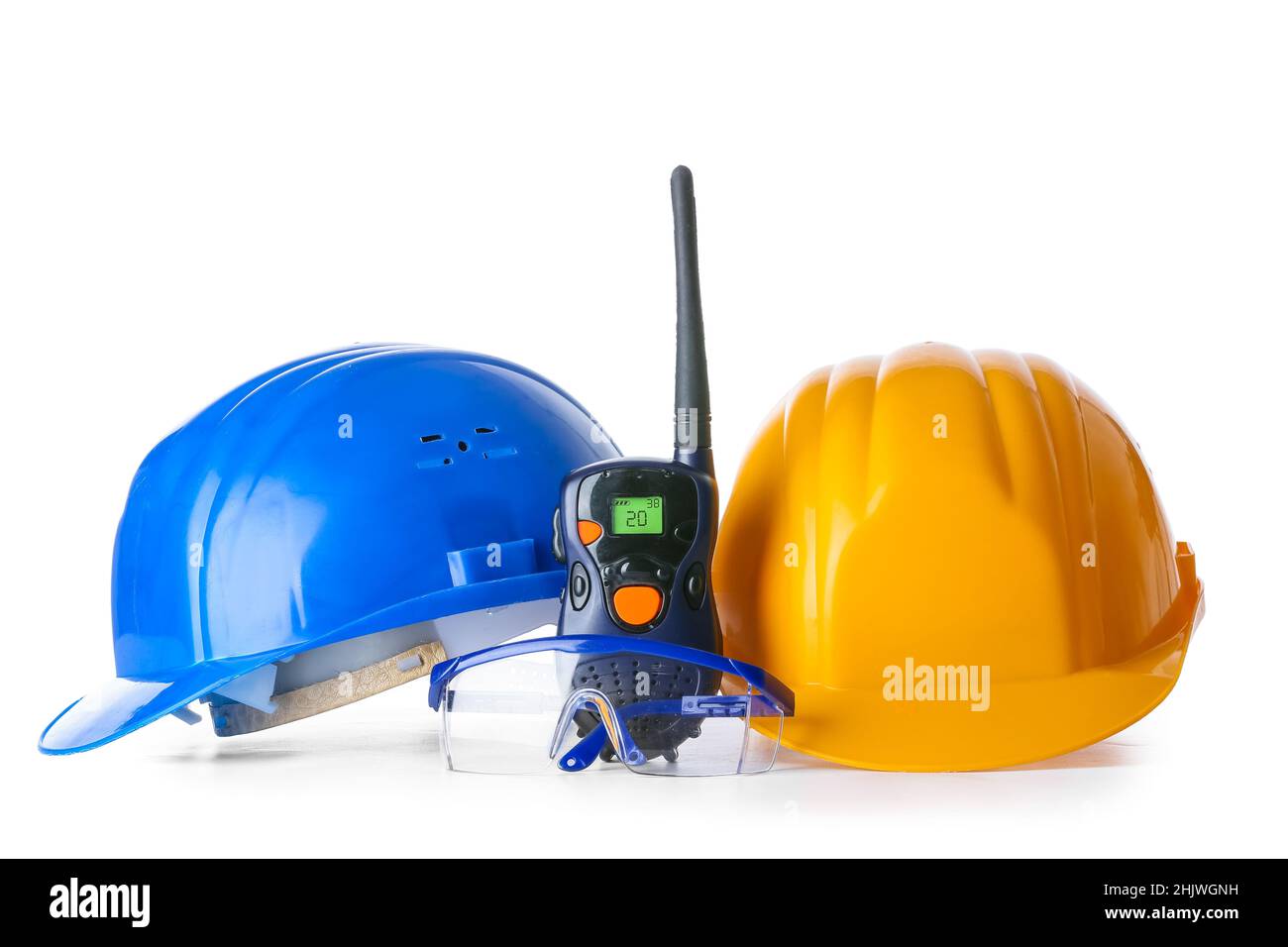 Safety equipment and radio transmitter on white background Stock Photo