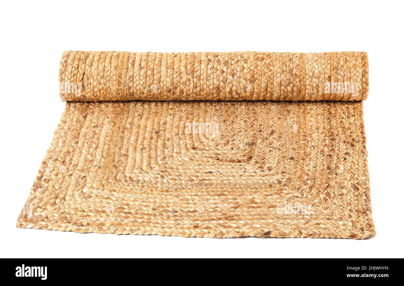 Trendy wicker carpet on white background Stock Photo - Alamy