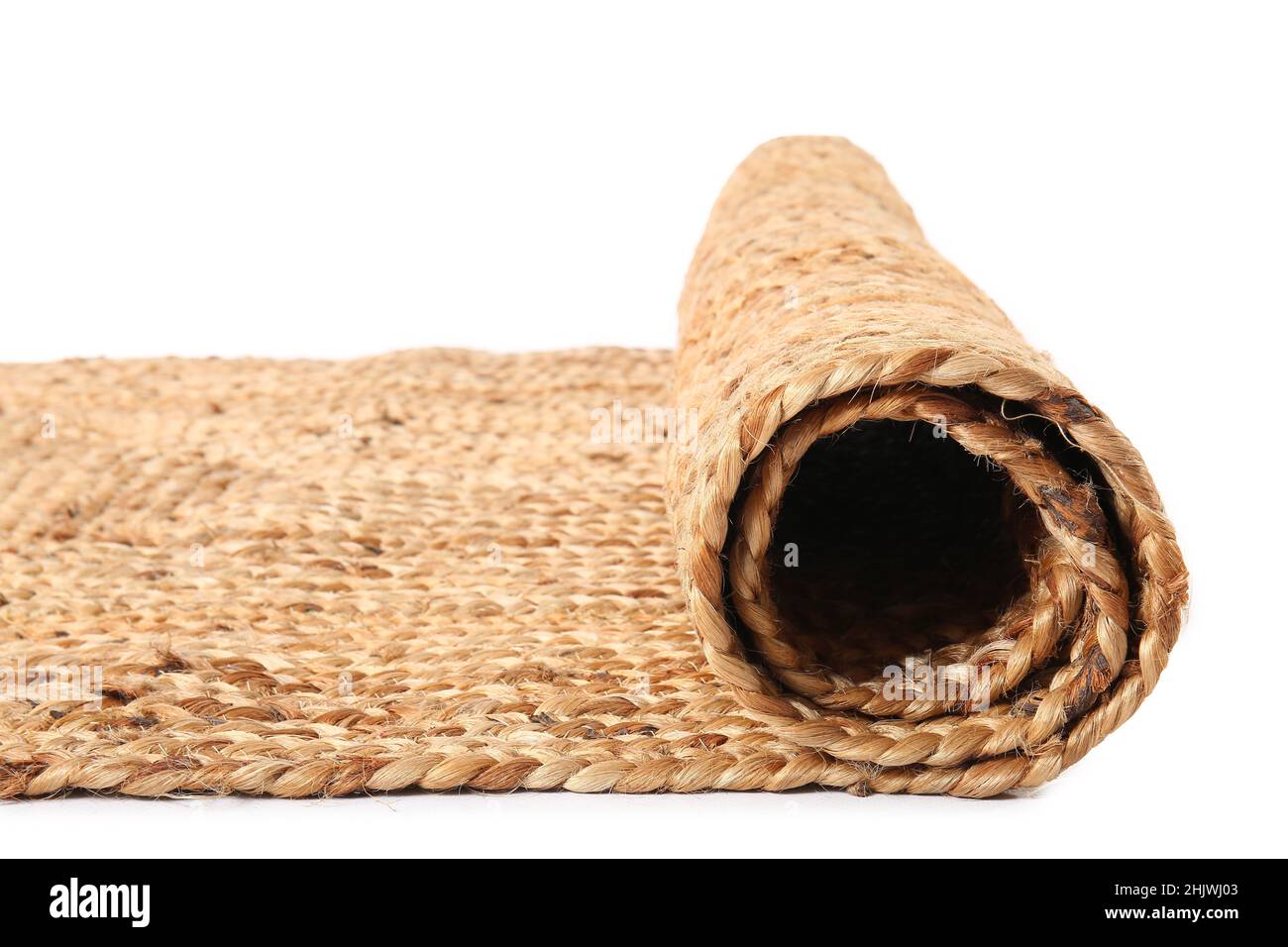 Stylish wicker rug on white background Stock Photo - Alamy