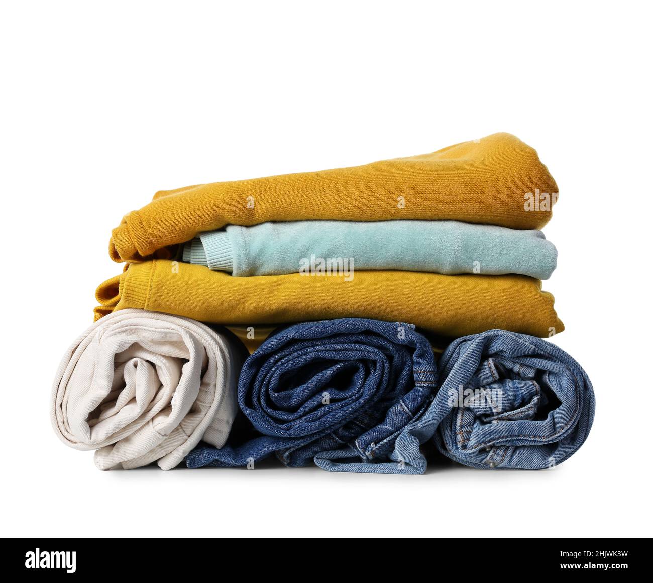 Different female sweaters and jeans on white background Stock Photo