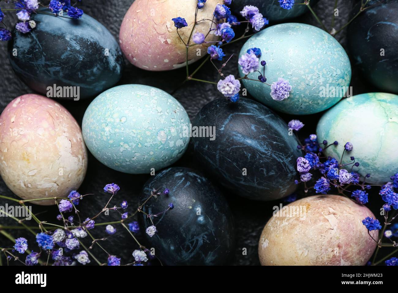 Beautiful composition with painted Easter eggs and gypsophila flowers ...