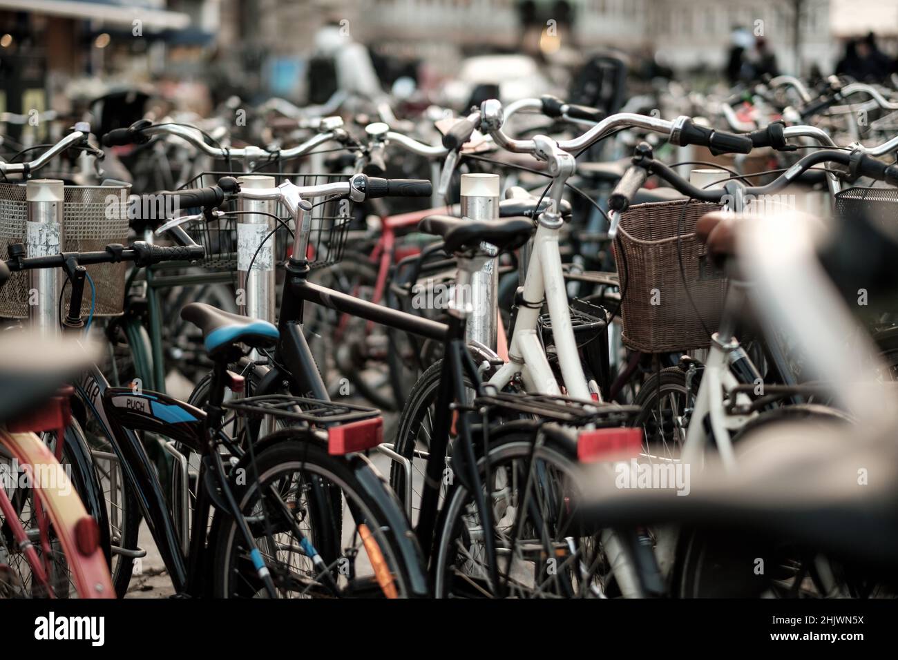 More than 60% of Danes ride a bike each day to commute to and from work. Bicycle parking can be found all around the city of Copenhagen. Stock Photo