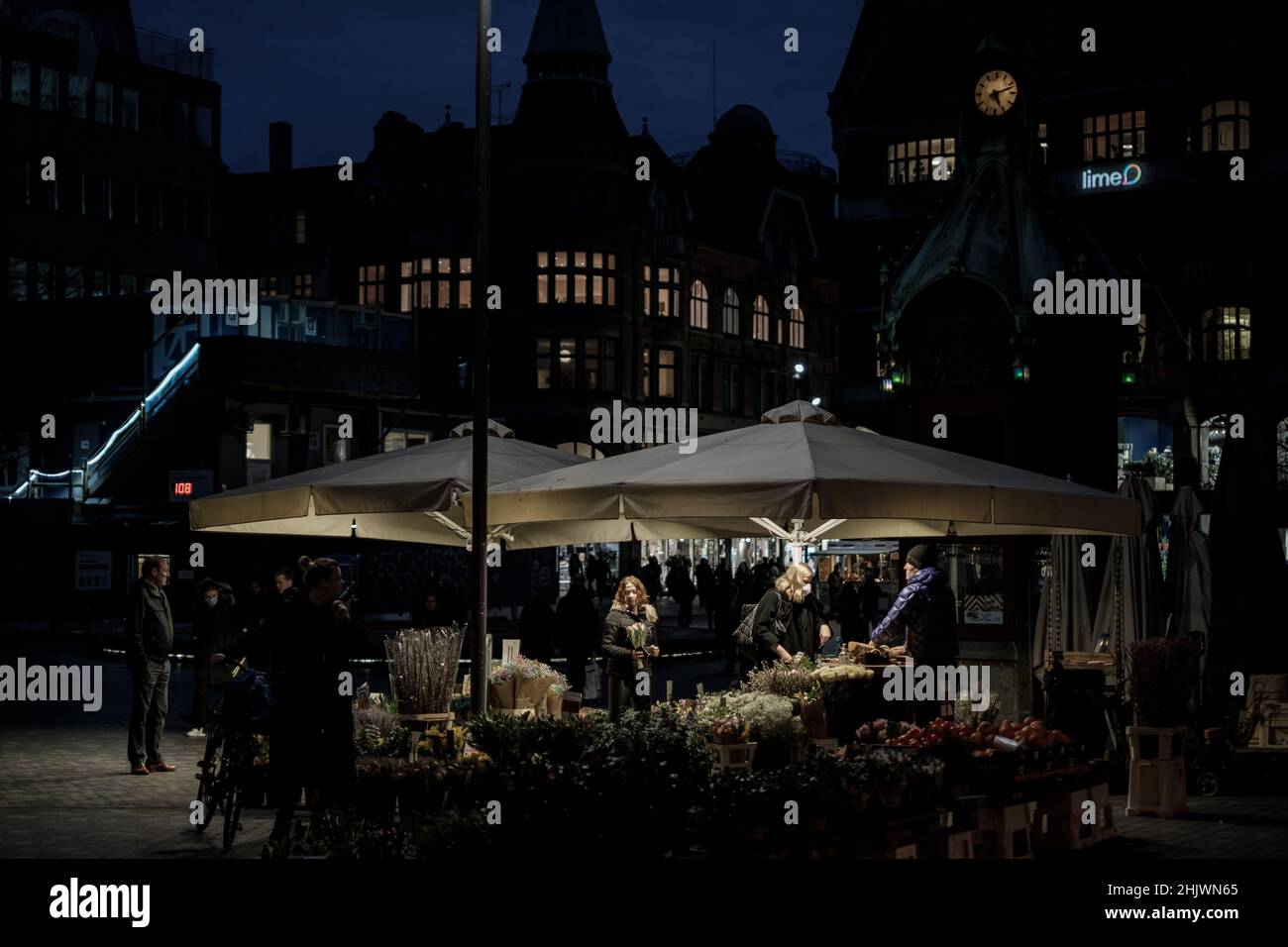 Copenhagen, Denmark January 31, 2022. Commuters stop at an outdoor