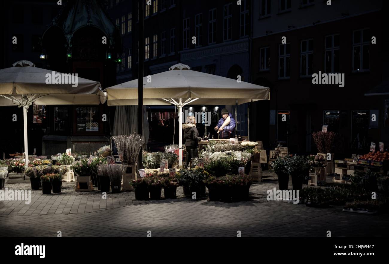 Copenhagen, Denmark January 31, 2022. Commuters stop at an outdoor