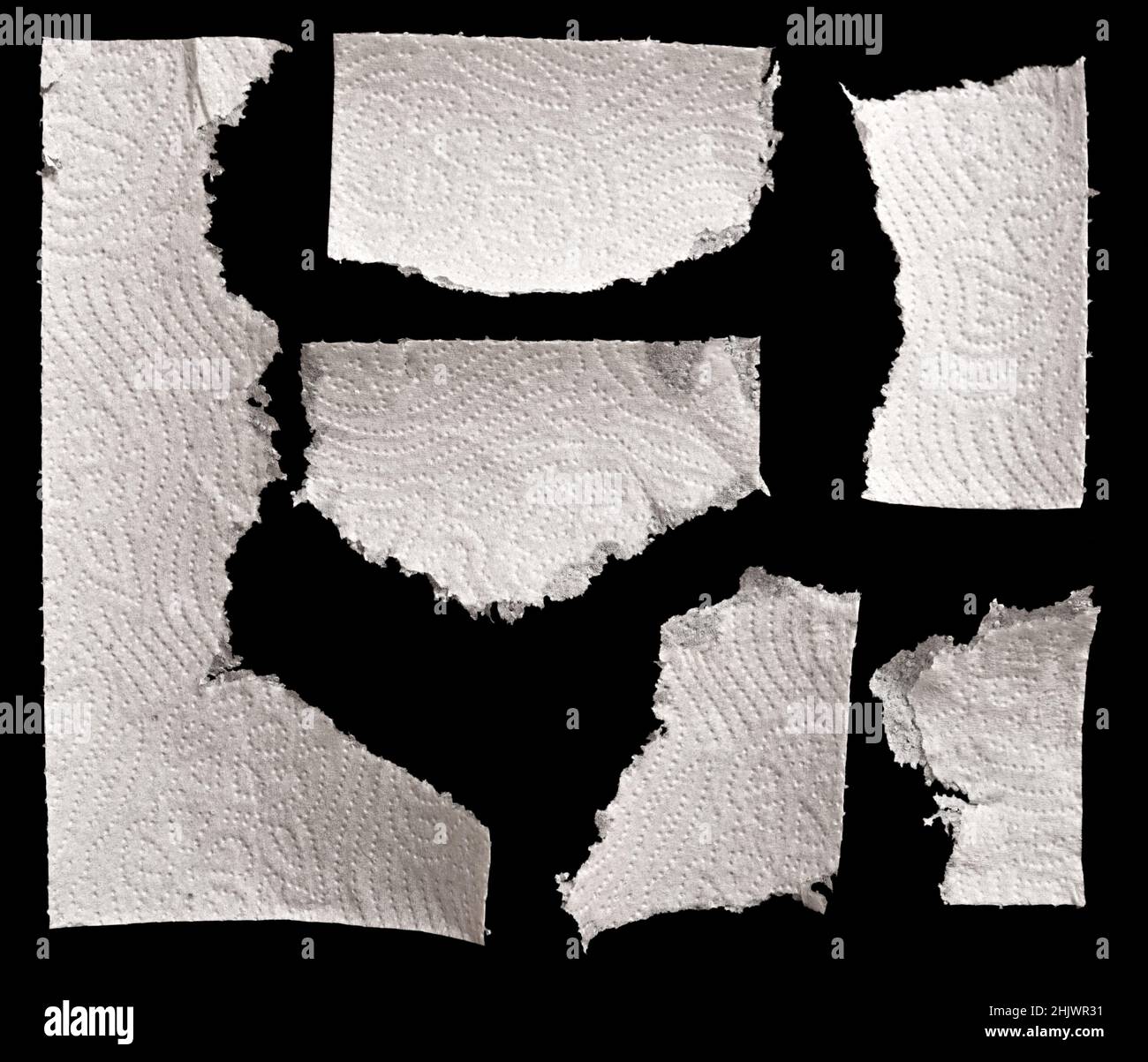 White torn napkin on black background Stock Photo