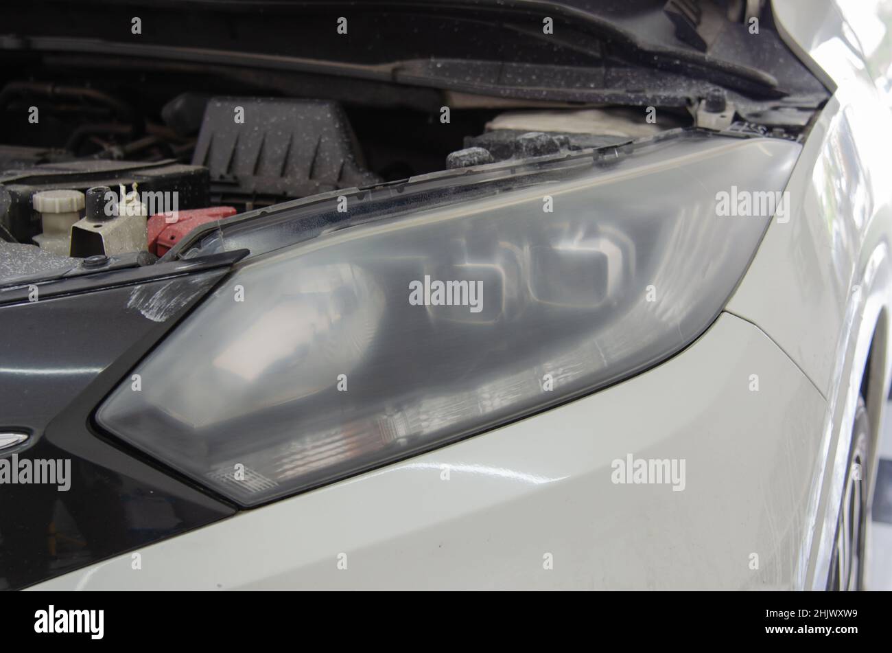 Car headlights before polishing. car details Stock Photo Alamy