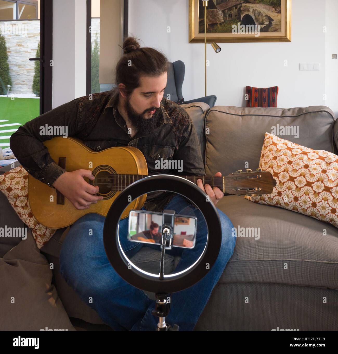 young man making a video tutorial for streaming and video blogging Stock Photo