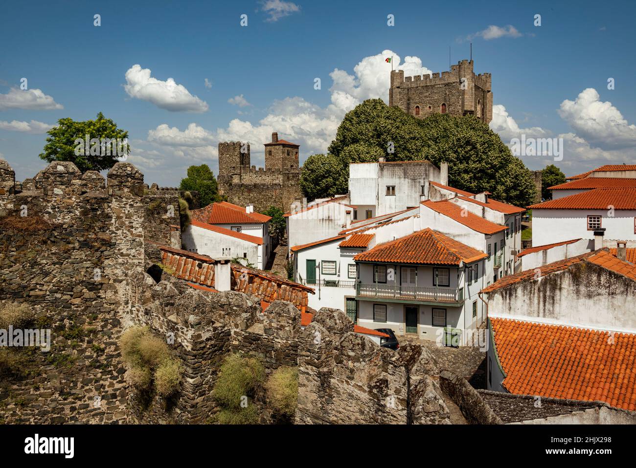 View towards the tower of 'Castelo de Bragança' castle surrounded by white houses with red rooftops, Bragança district, Montesinho, Portugal Stock Photo