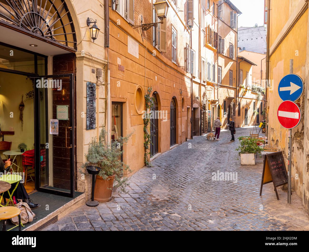 narrow-street-with-cafe-and-small-shops-in-rome-stock-photo-alamy