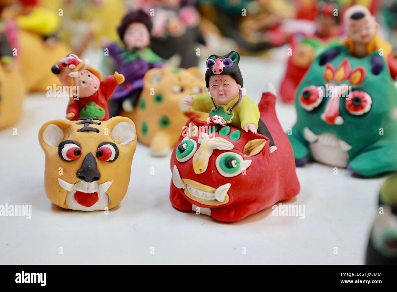 Beijing, China. 17th Jan, 2022. Photo taken on Jan. 17, 2022 shows tiger-themed dough modelling in Xinxiang, central China's Henan Province. With the arrival of Chinese New Year on Tuesday, the country enters the Year of the Tiger.Tiger, one of the 12 animal signs of the Chinese zodiac, symbolizes strength, bravery and fearlessness. Credit: Zhao Yun/Xinhua/Alamy Live News Stock Photo
