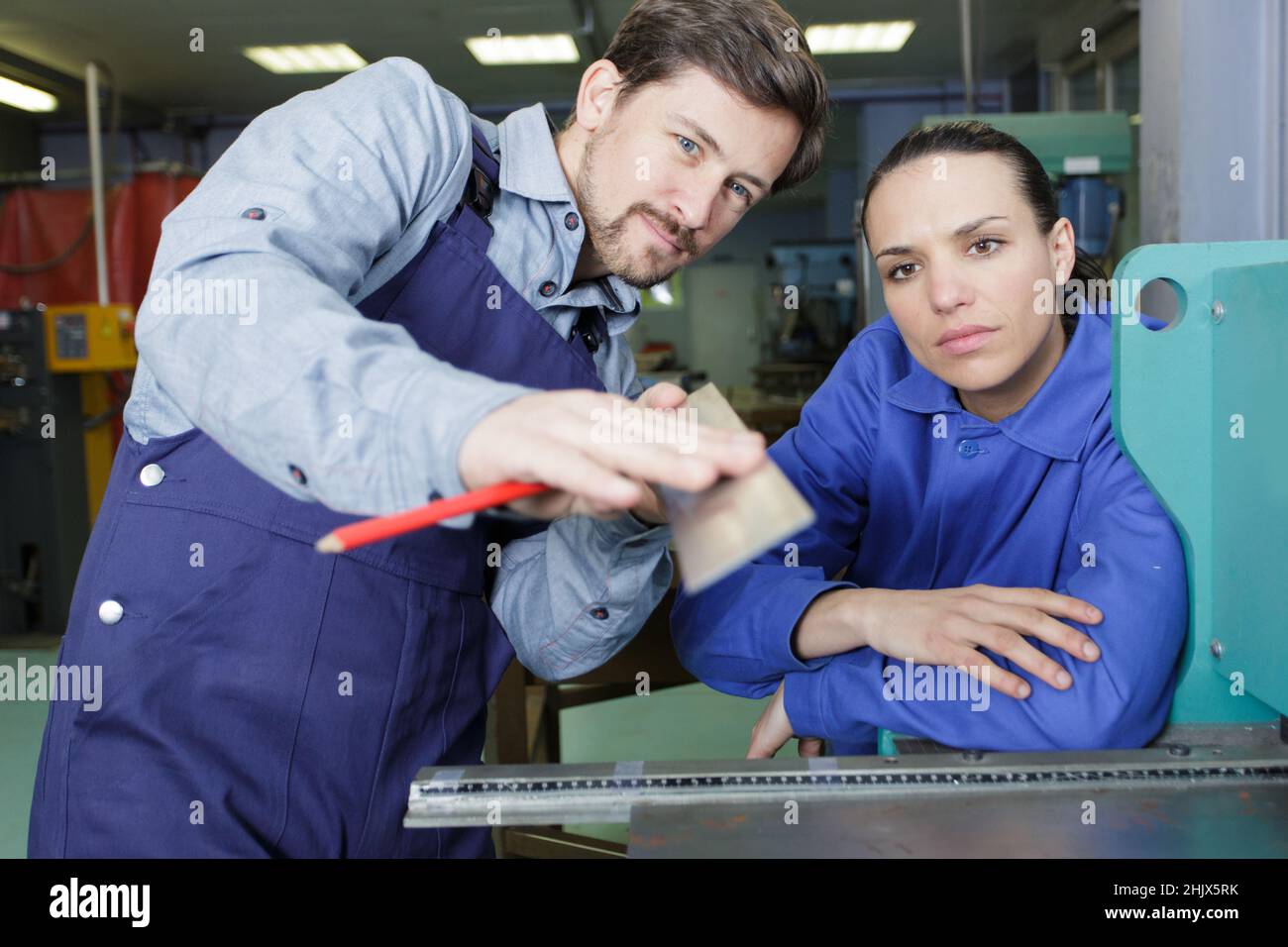 man and woman with machine cnc Stock Photo - Alamy