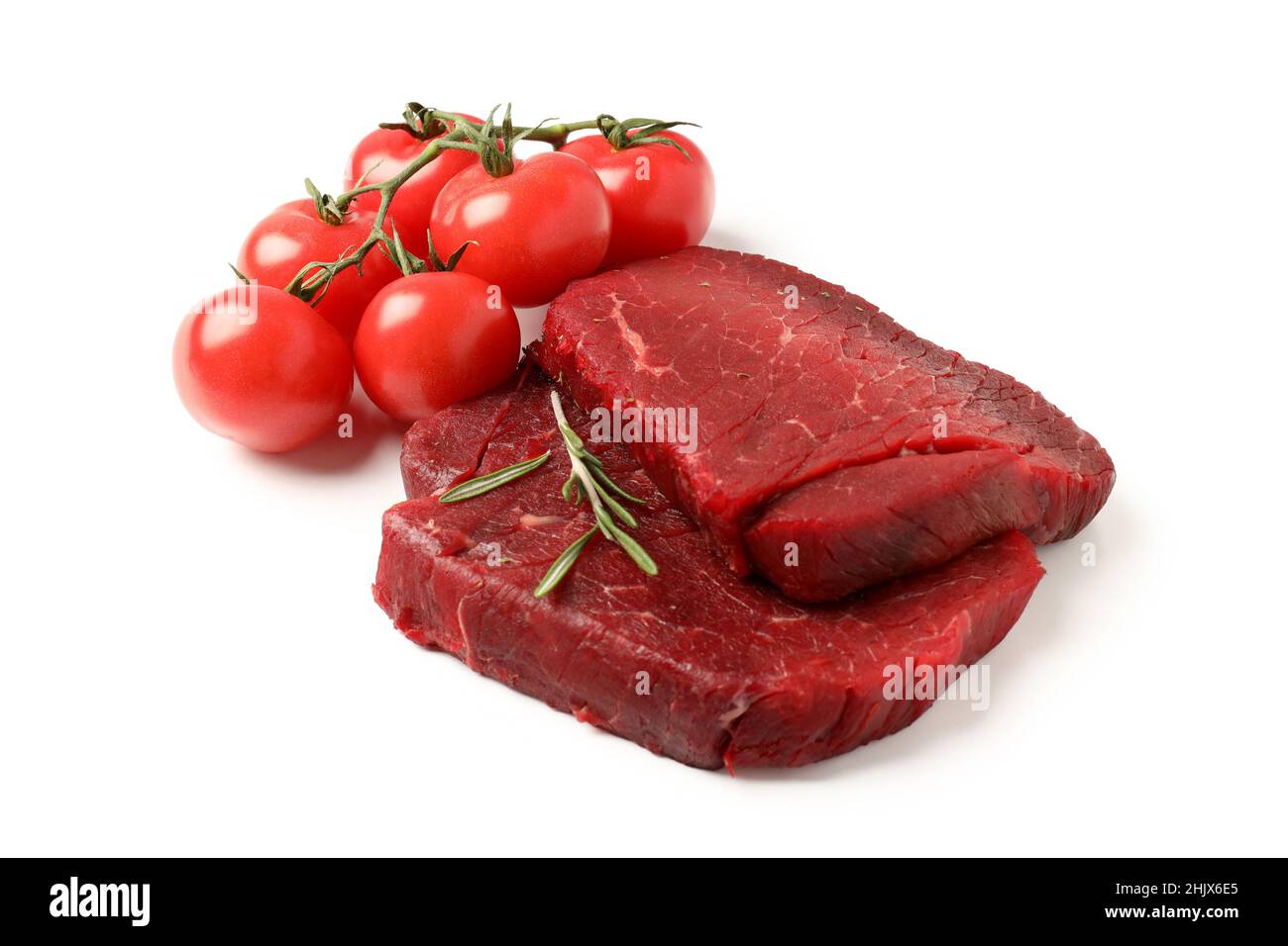 Raw beef steaks with tomatoes isolated on white background Stock Photo