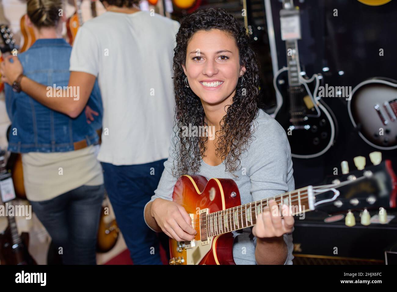 portrait of a beautiful woman with a guitar Stock Photo - Alamy