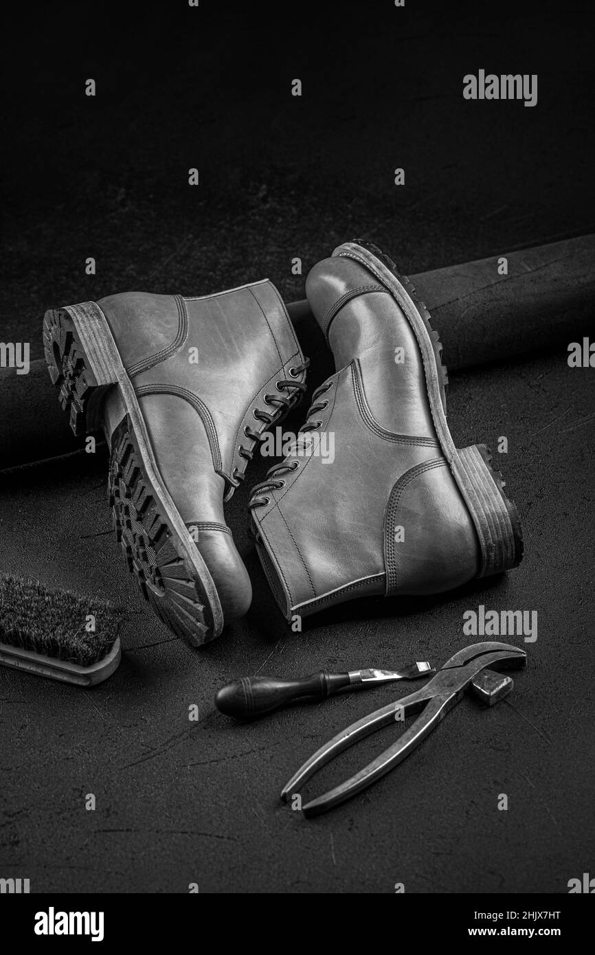 Handcrafted brown leather shoes with cobbler tools Stock Photo - Alamy