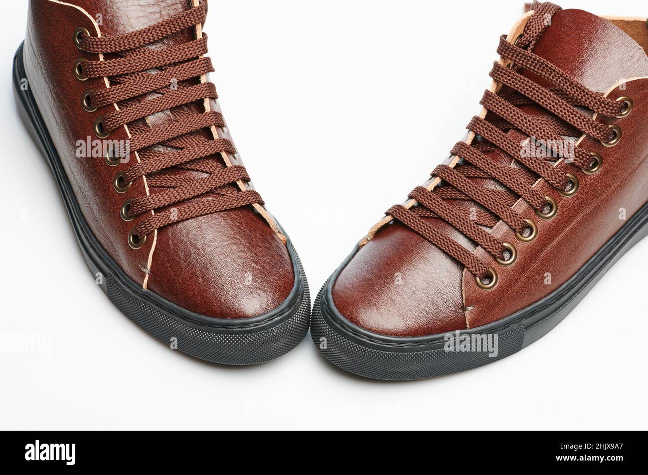 Original brown leather sneakers with laces isolated Stock Photo