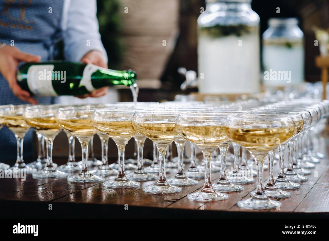 Pouring wine many glasses hires stock photography and images Alamy