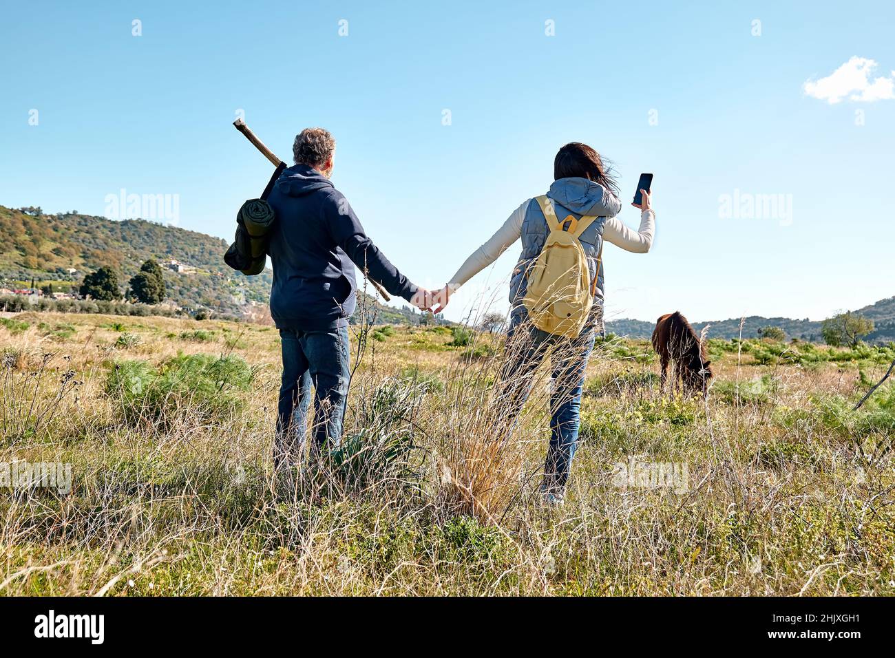 Smart couple holding hands hi-res stock photography and images - Alamy