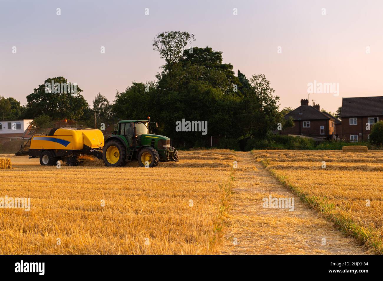 Process of hay making during harvesting Stock Photo Alamy