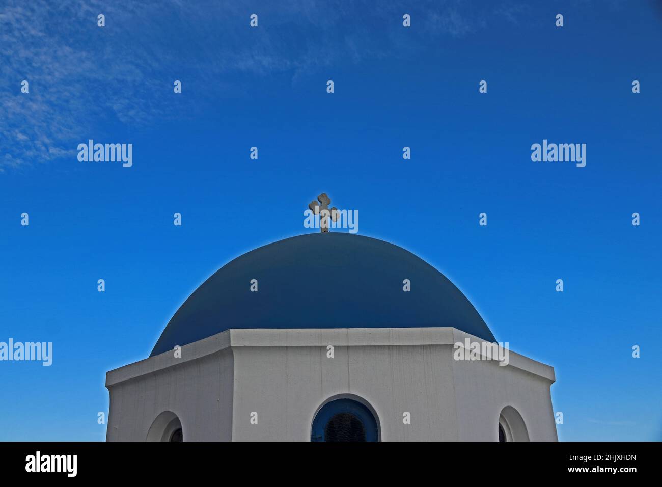 Blue dome with white cross against blue sky, Santorini, Greece Stock Photo