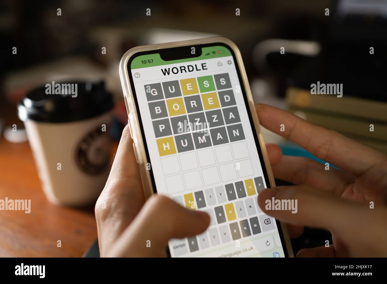 Bangkok, Thailand - February 1, 2022: A mobile user playing Wordle, a popular word game. Stock Photo