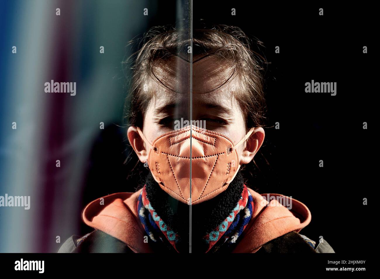 Boys face distorted in reflection. Stock Photo