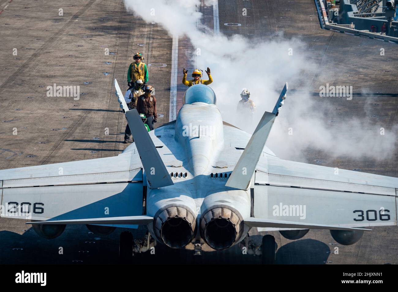 South China Sea, United States. 24 January, 2022. A U.S. Navy F/A-18E Super Hornet fighter jet, attached to the Golden Dragons of Strike Fighter Squadron 192, prepares to launch off the flight deck of the Nimitz-class aircraft carrier USS Carl Vinson during dual carrier operations January 24, 2022 in the South China Sea.  Credit: MCS Leon Vonguyen/Planetpix/Alamy Live News Stock Photo