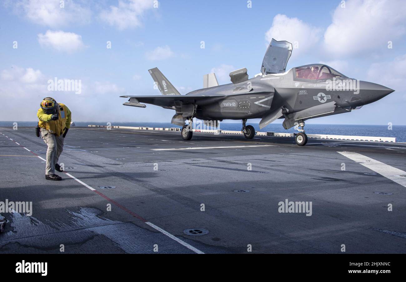 Philippine Sea, United States. 29 January, 2022. A U.S. Marine Corps F-35B Lightning II fighter aircraft from the 31st Marine Expeditionary Unit, is signaled for launch off the flight deck of the amphibious assault ship USS America during routine patrol January 29, 2022 in the Philippine Sea.  Credit: MC3 Theodore C. Lee/Planetpix/Alamy Live News Stock Photo
